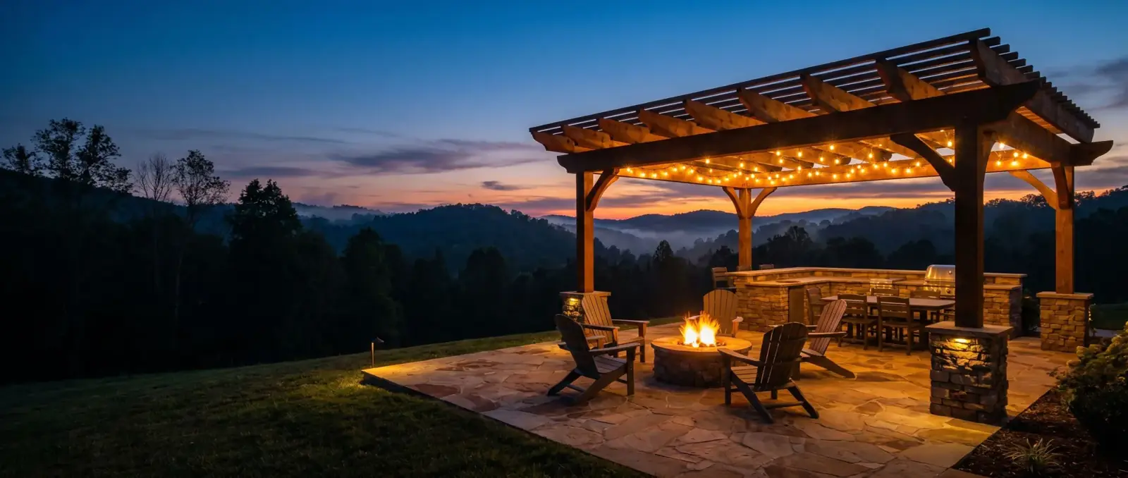 Stone patio with fire pit and pergola overlooking East Tennessee hills at dusk